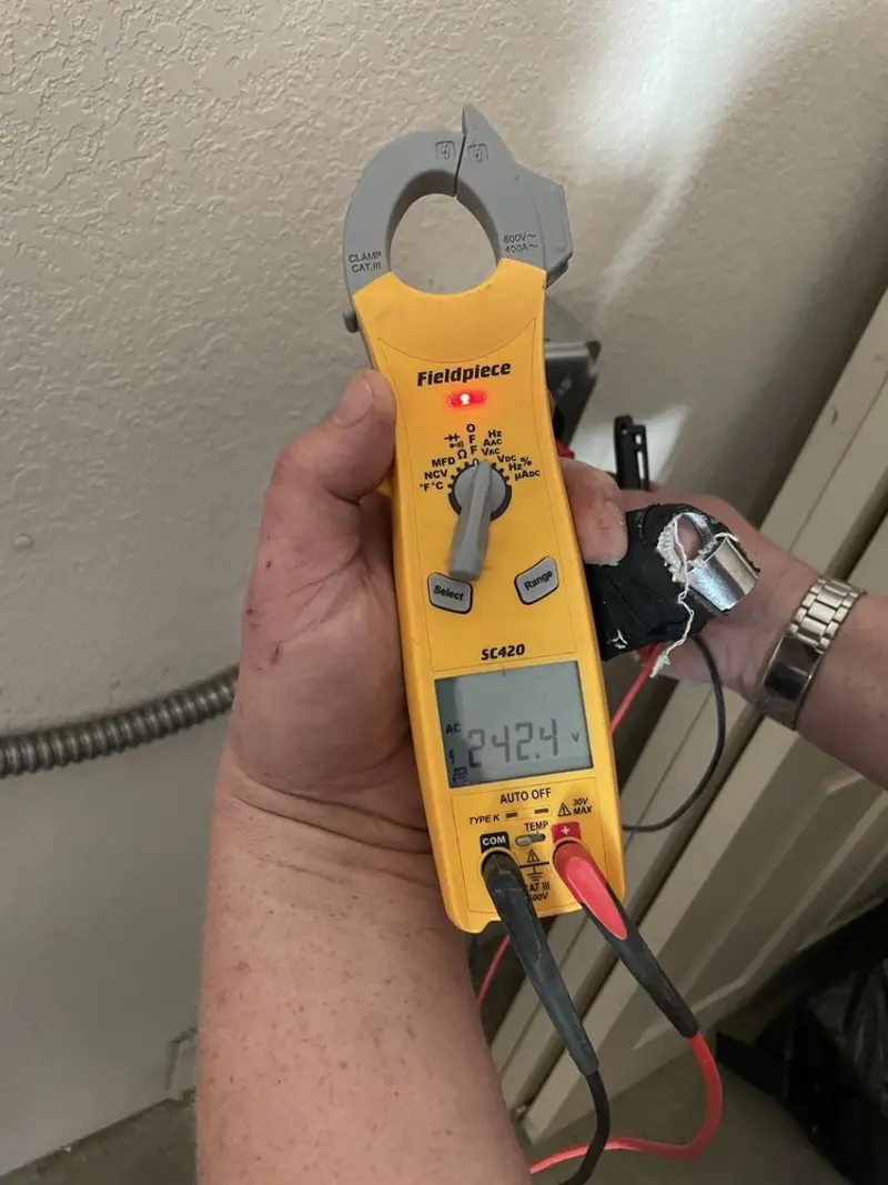 Voltage testing with clamp meter during Aluminum Wiring Replacement in Dickson